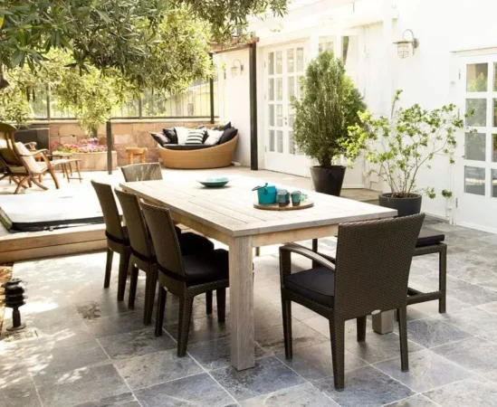 Modern patio dining set on stone tiles