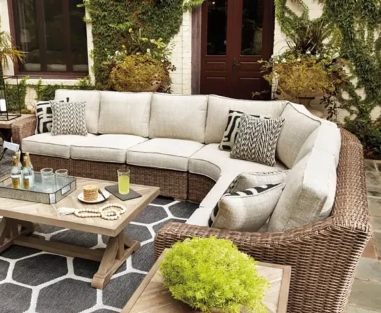 Outdoor patio with wicker sectional and coffee table