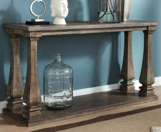 Wood console table with decorative objects and vase.