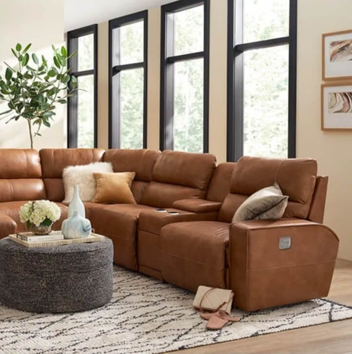 Cozy brown sectional in sunlit living room.