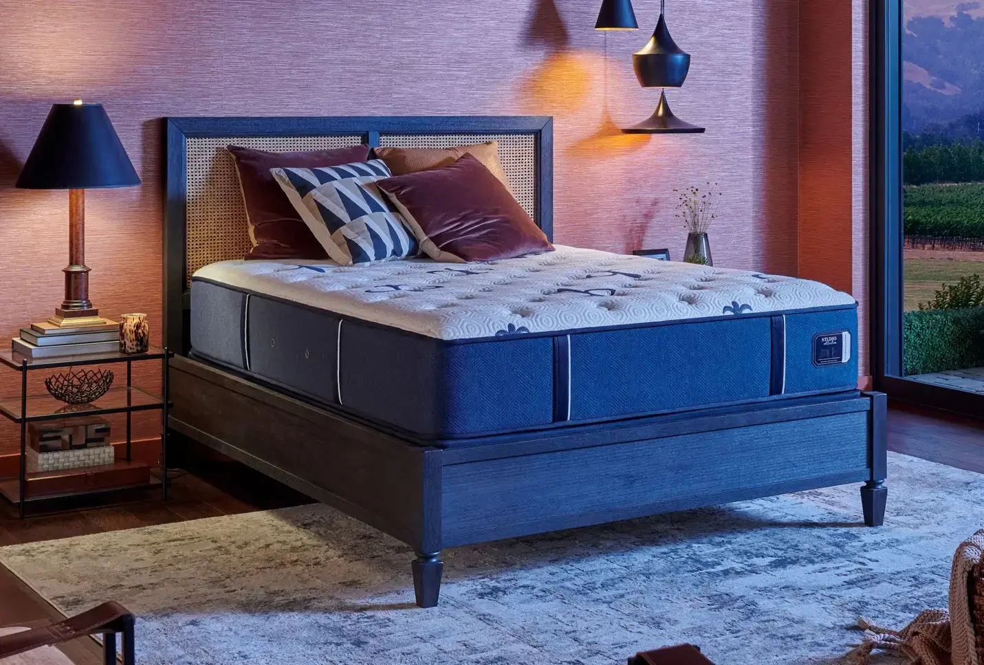 Modern bedroom with elegant bed and decor.