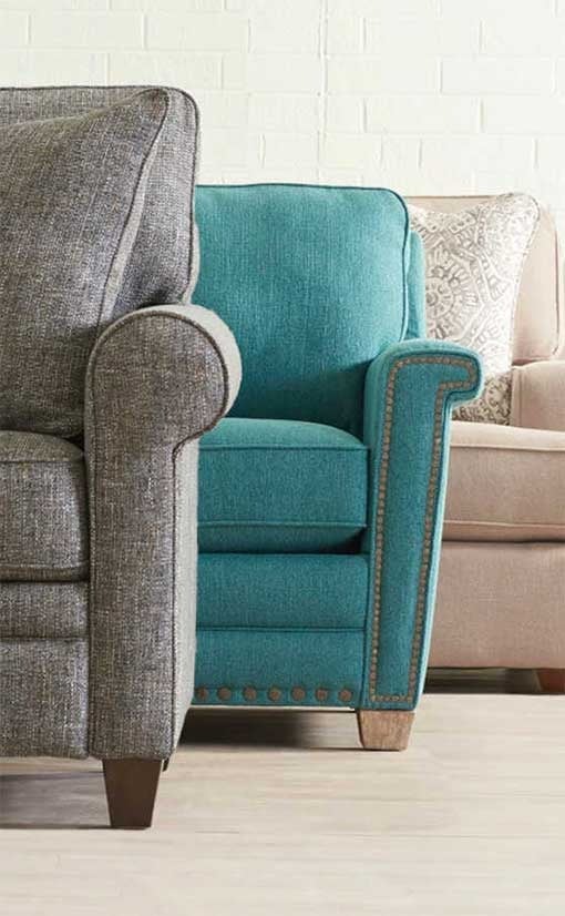 Three colorful armchairs in living room