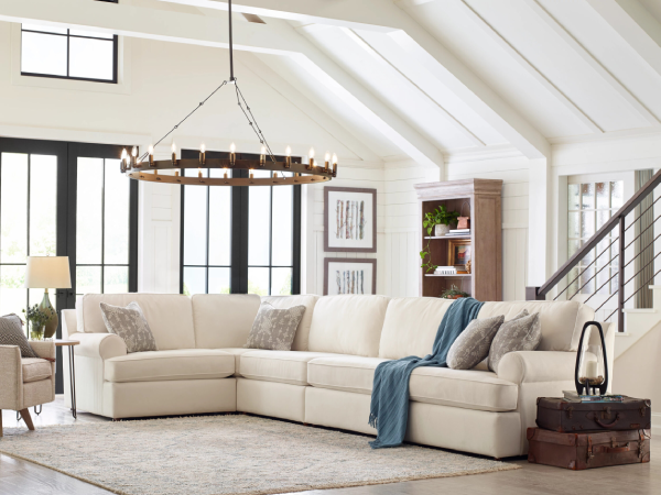 Spacious living room with white sectional sofa
