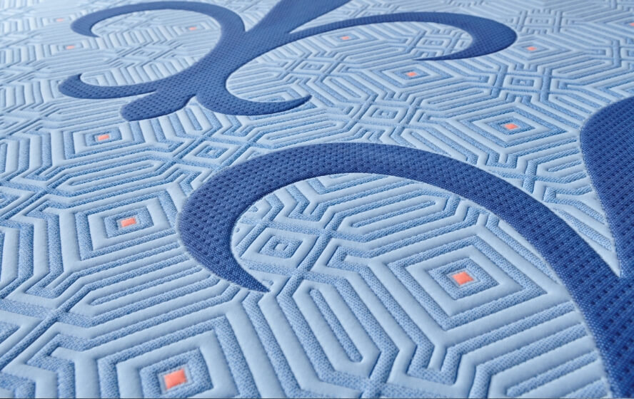 Close-up of blue patterned mattress design.