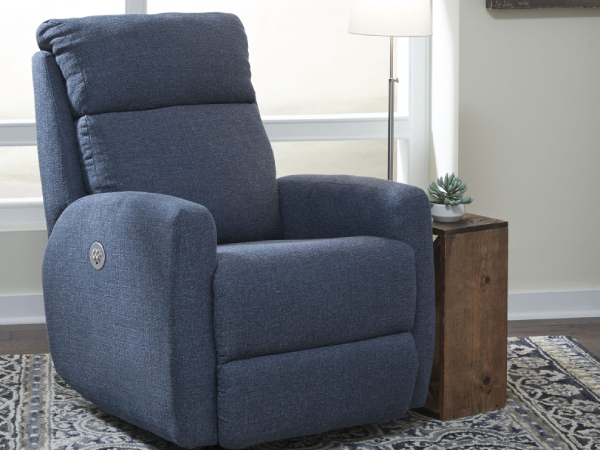 Blue reclining chair in a living room setting.